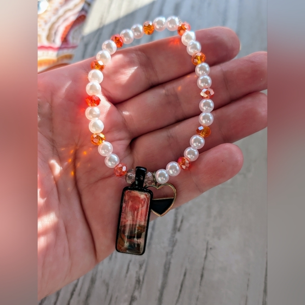 White and Orange Beaded Bracelet with Heart Charm
